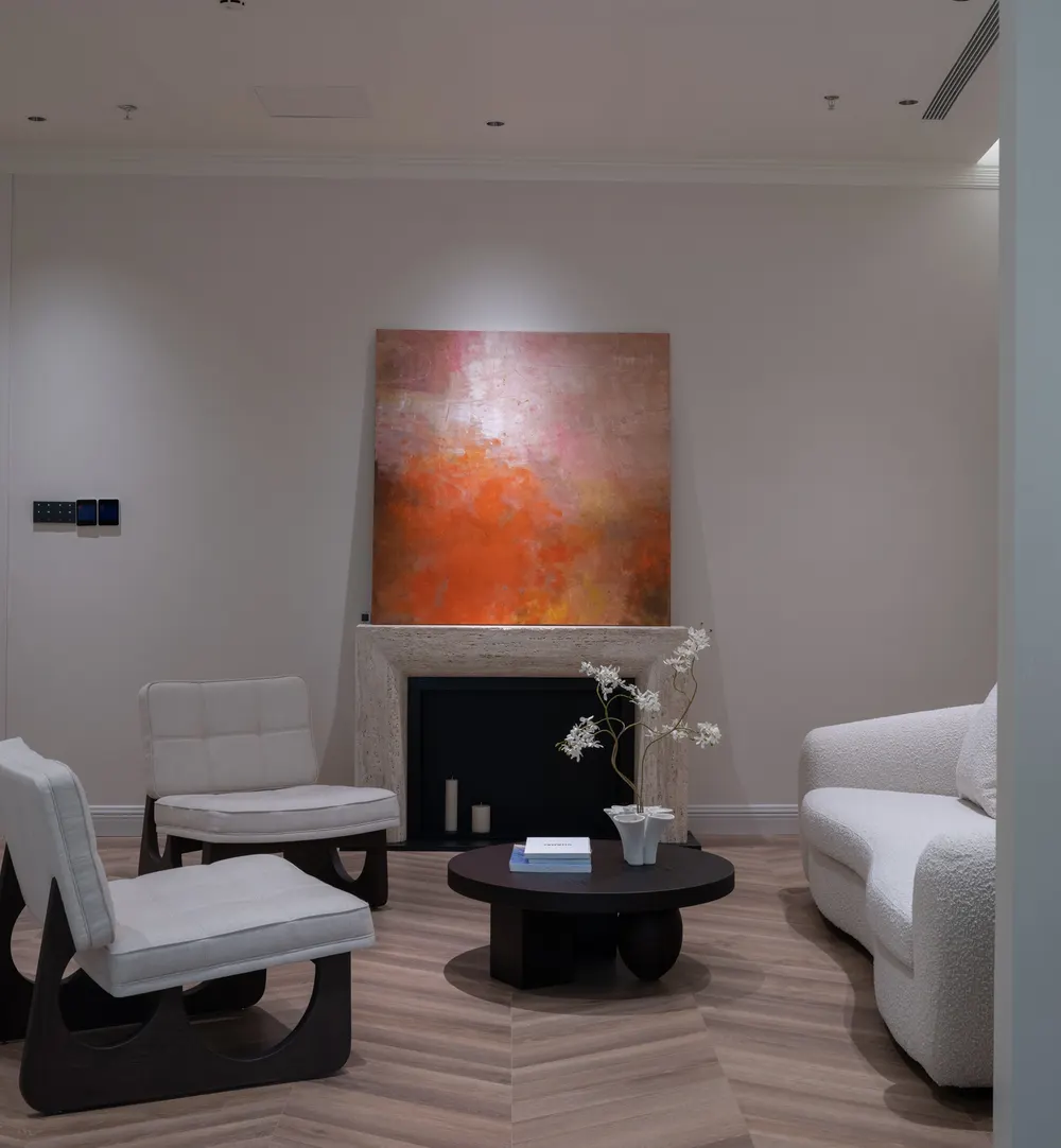 Fireside lounge with abstract artwork